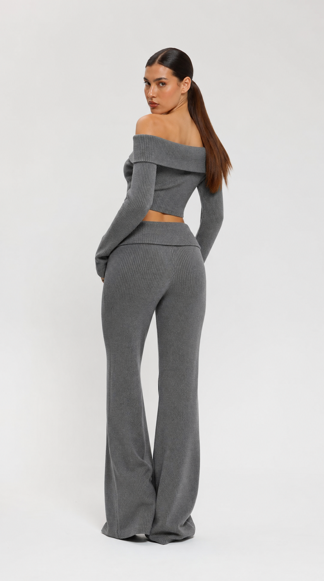 Grey two-piece off-shoulder knit top and flared trousers set