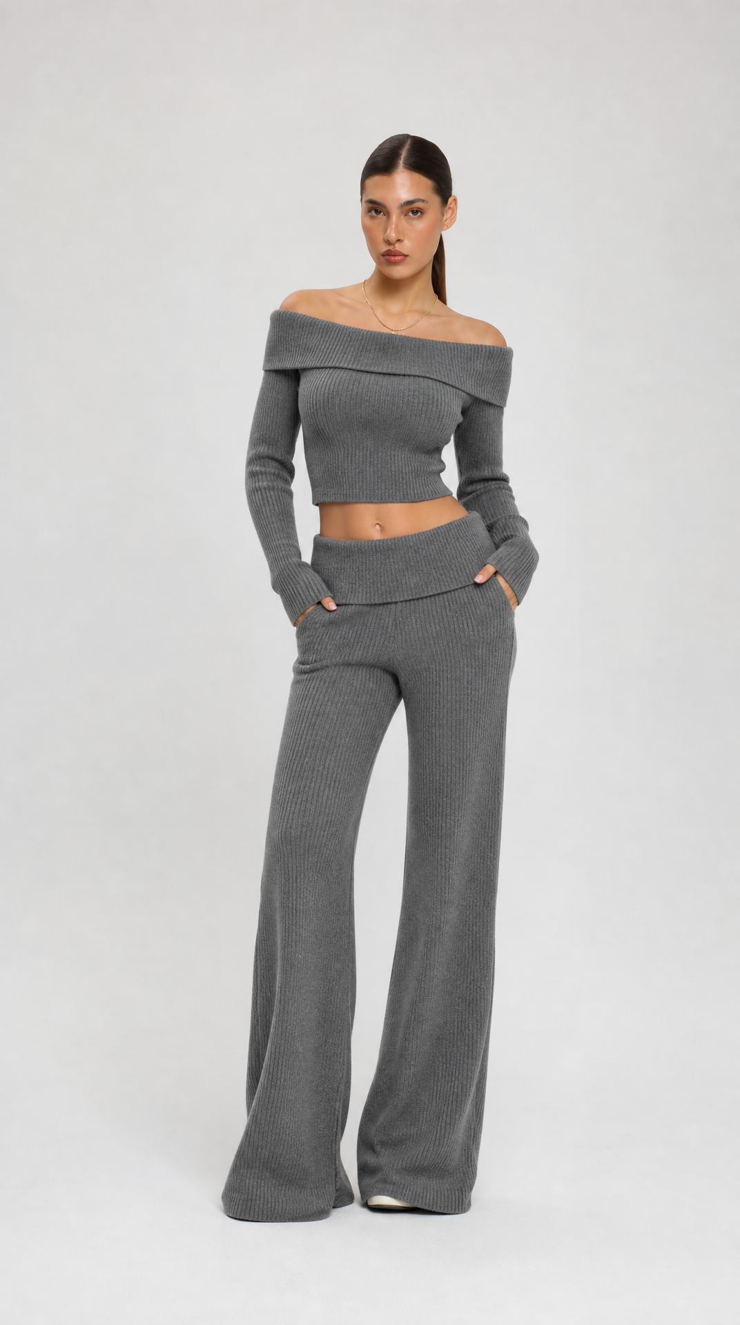 Grey two-piece off-shoulder knit top and flared trousers set