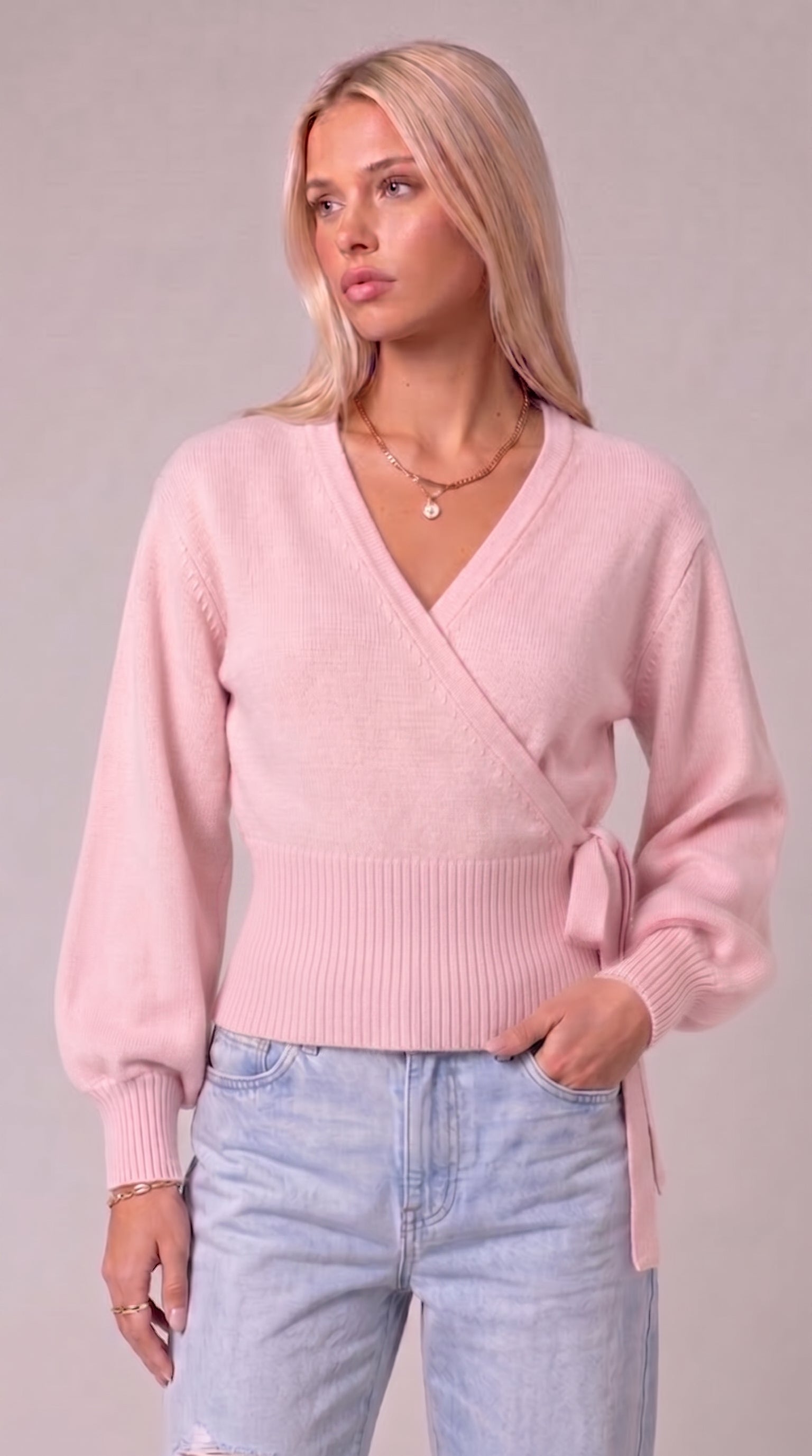 Pink wrap blouse with balloon sleeves and side tie