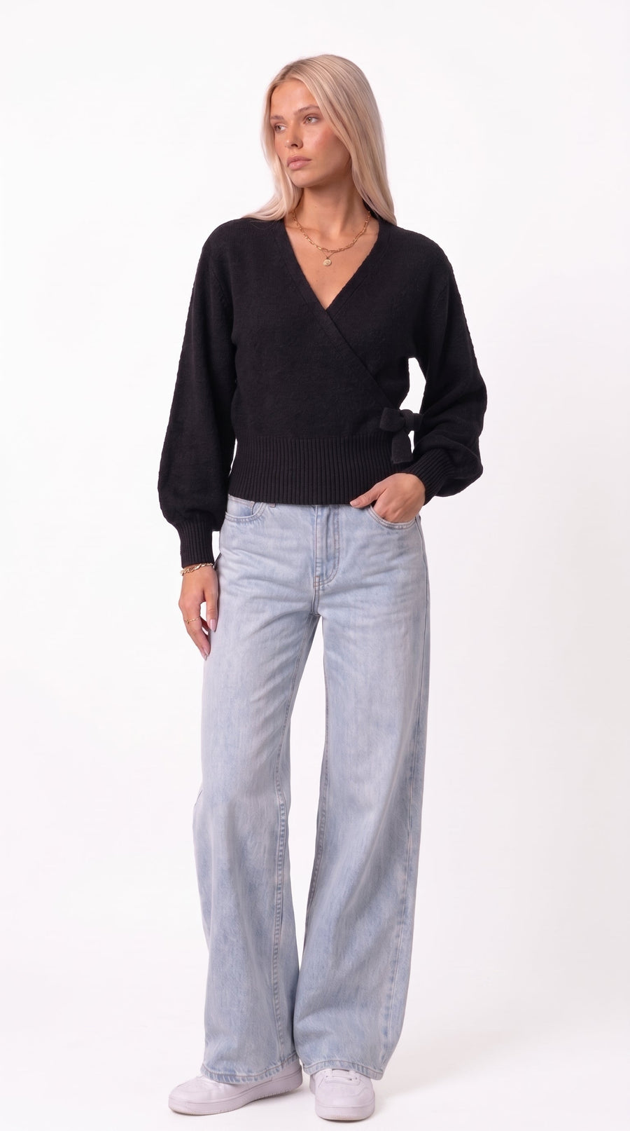 Black wrap blouse with balloon sleeves and side tie
