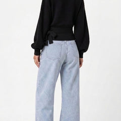 Black wrap blouse with balloon sleeves and side tie
