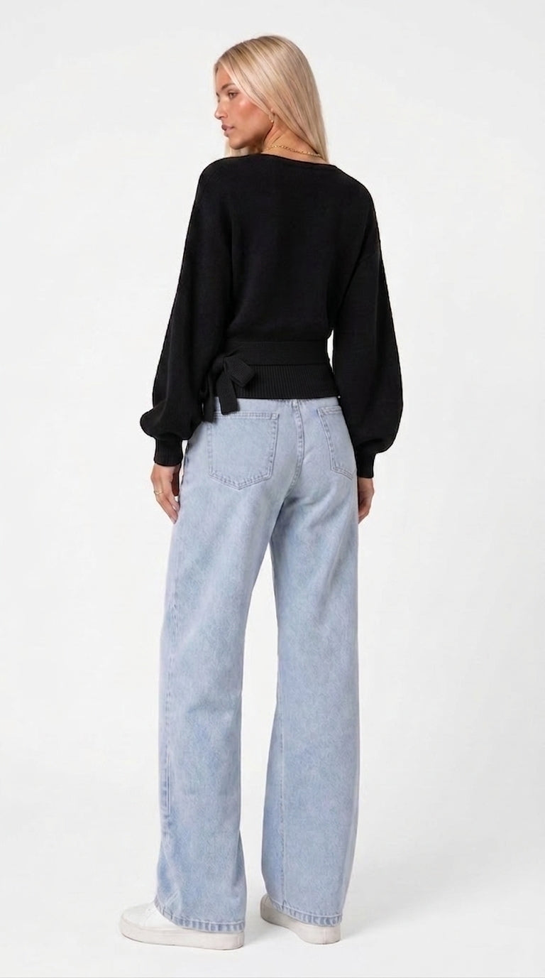 Black wrap blouse with balloon sleeves and side tie