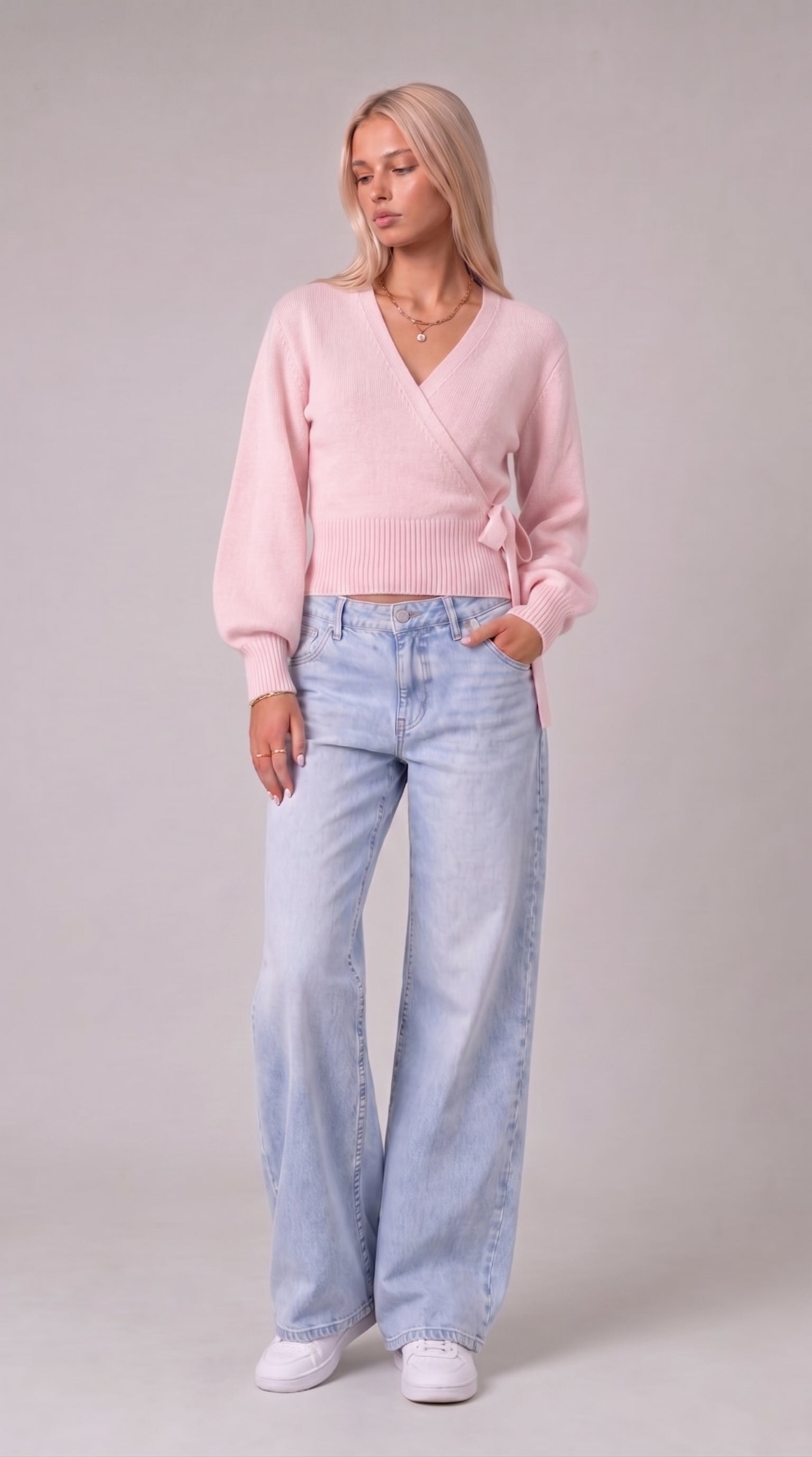 Pink wrap blouse with balloon sleeves and side tie